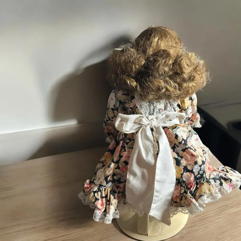 18” porcelain doll with flower dress and brown hair